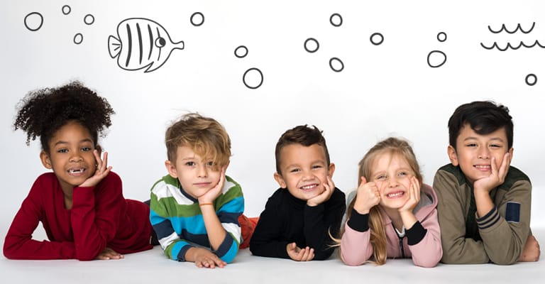 Children holding hands and smiling