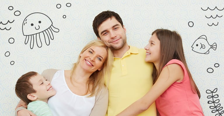 Smiling family hugging